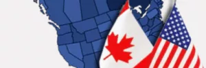 North American provinces and states highlighted in blue and a Canadian and American flag