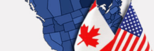 Blue map of North America with a Canadian and an American flag