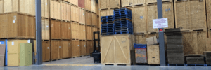 Tippet Richardson storage facility with wooden storage crates stacked up for short and long-distance moves